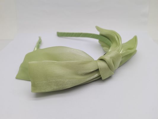 Banda de pelo de tejido verde para su colección